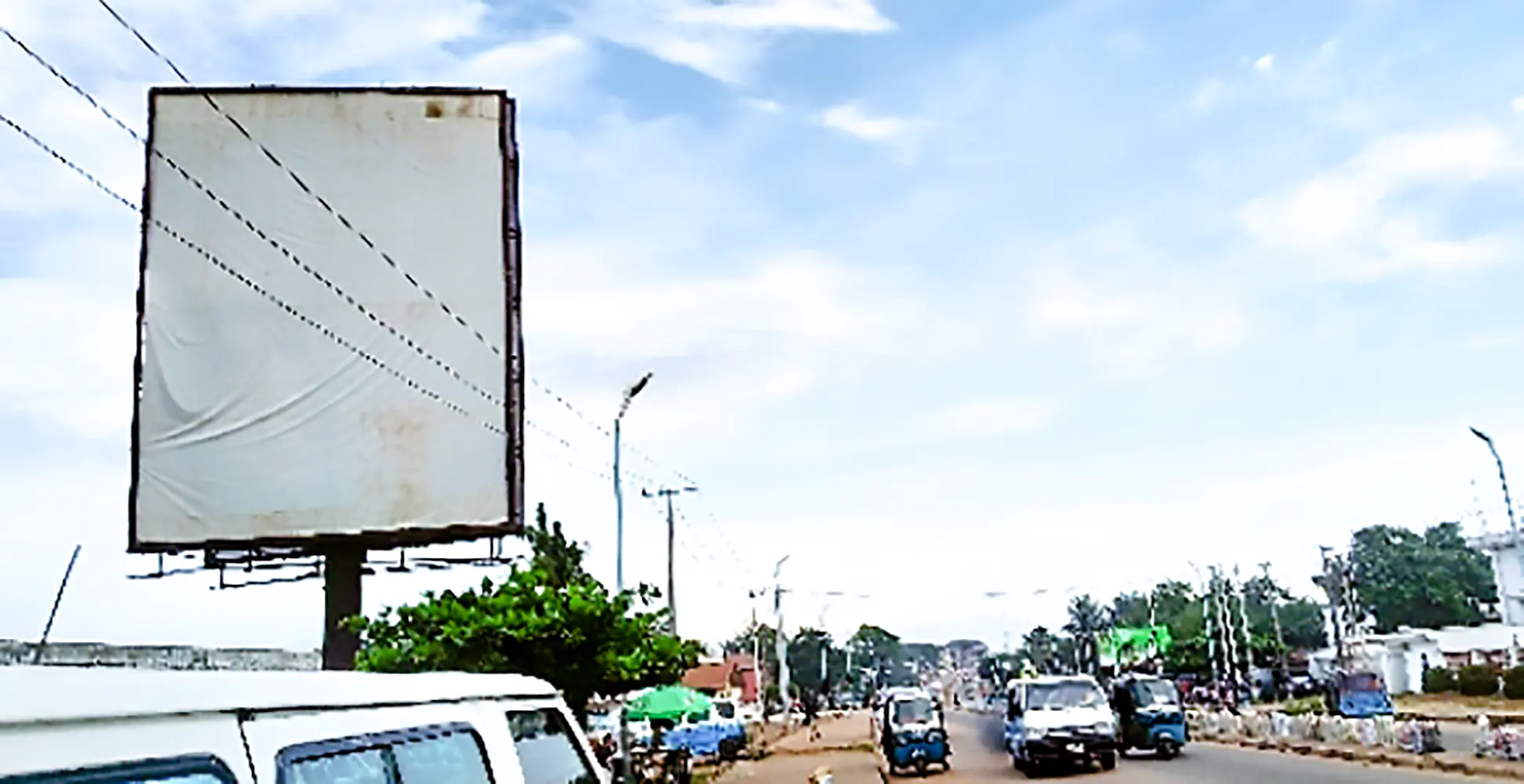 Portrait - Asaba Along Dennis Osadebe Road By Nitel Fence